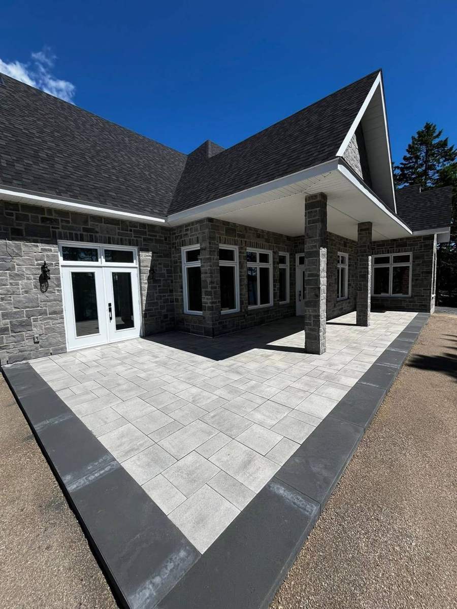 Large-format slab patio under covered porch