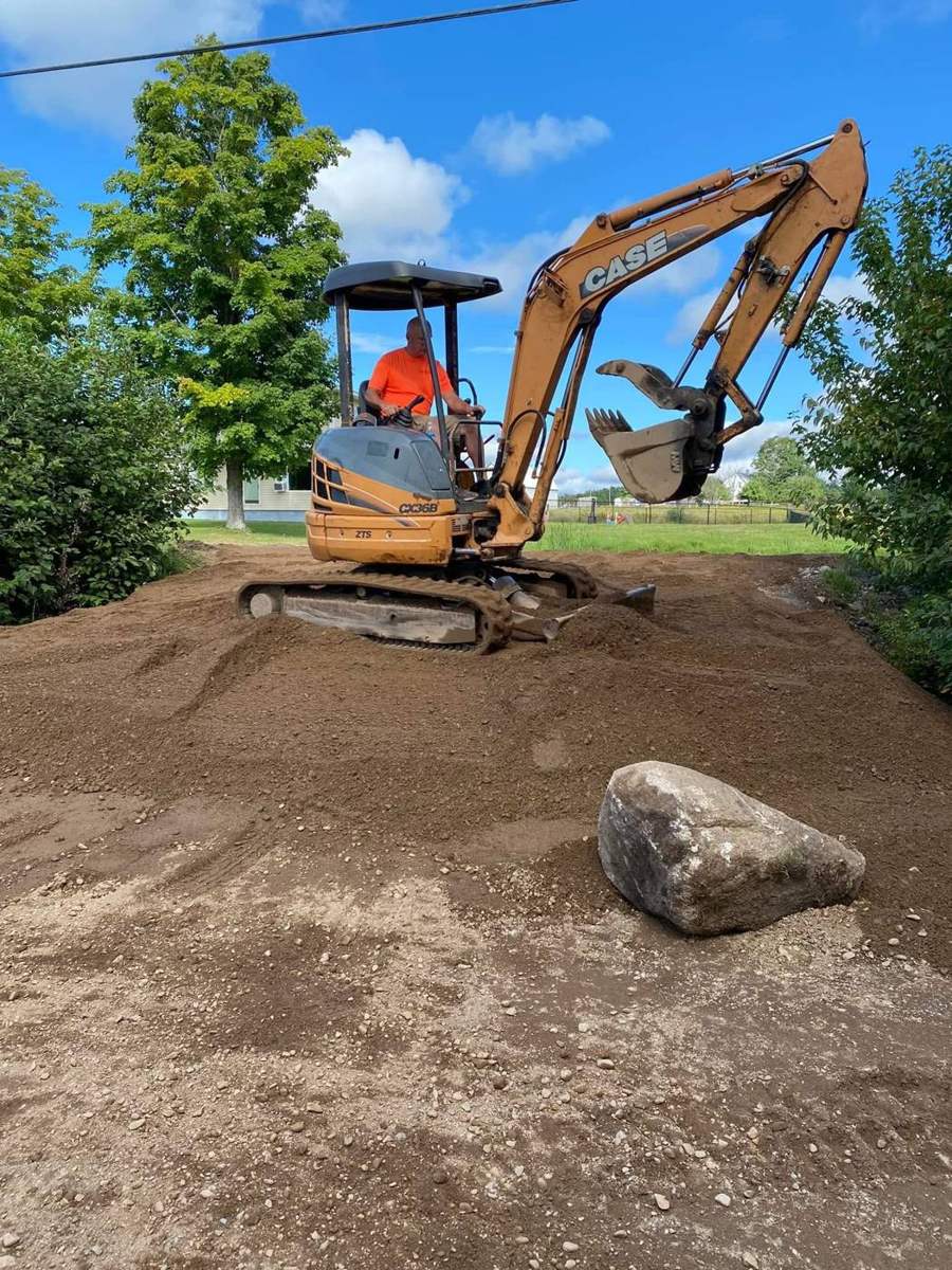 Grading with the mini excavator