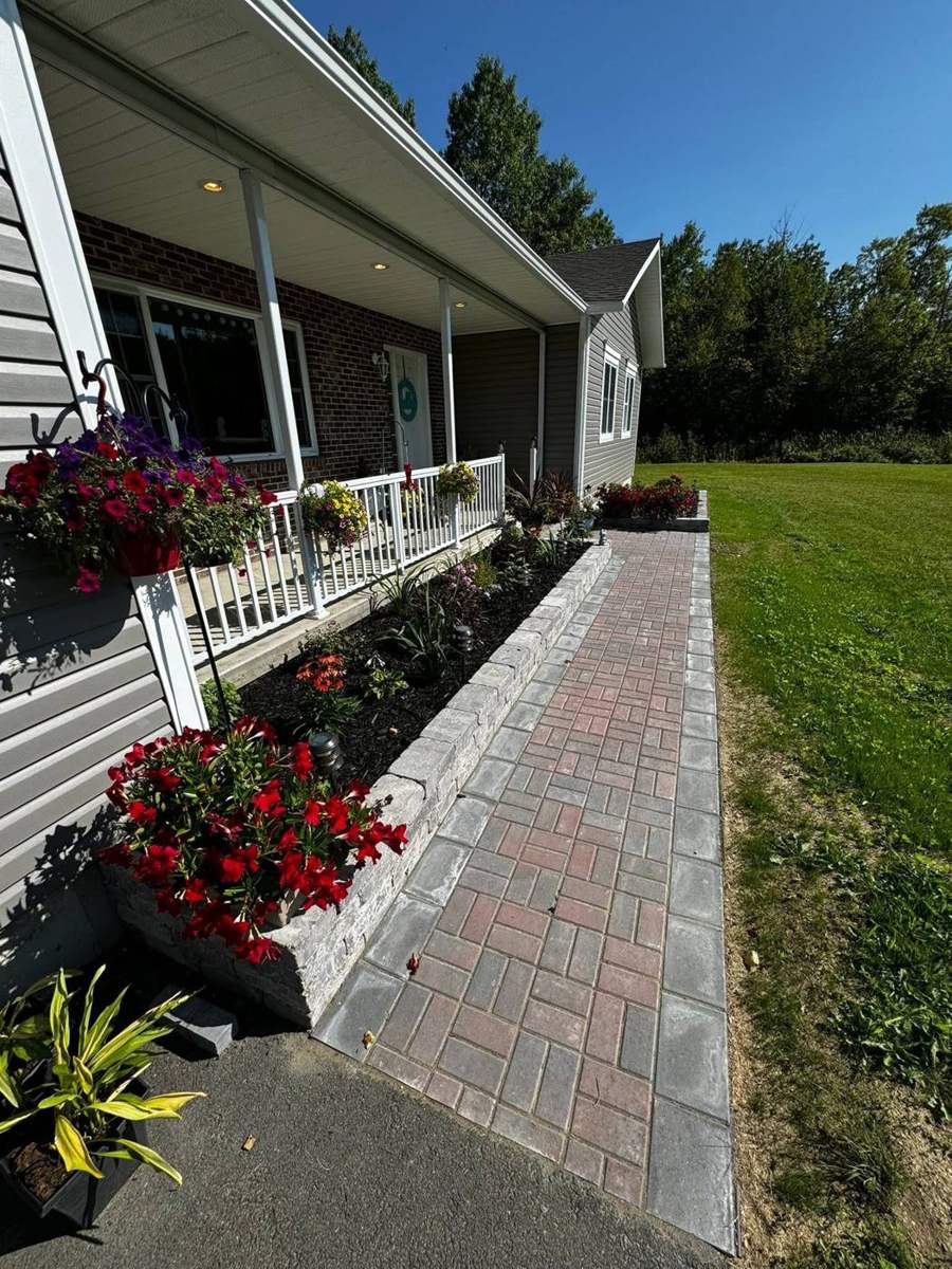 Paver walkway with raised garden wall