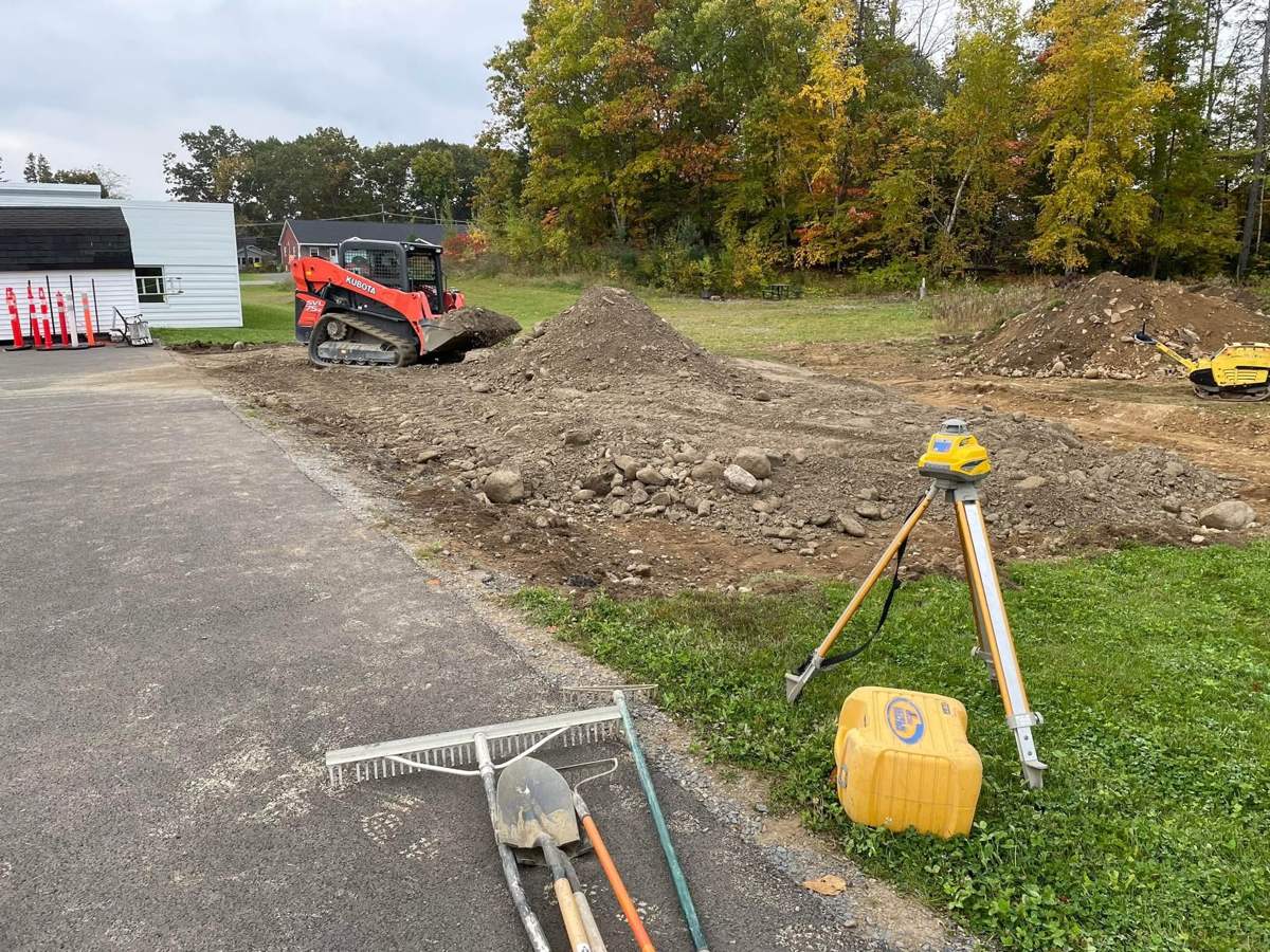 Excavating and grading with a laser level
