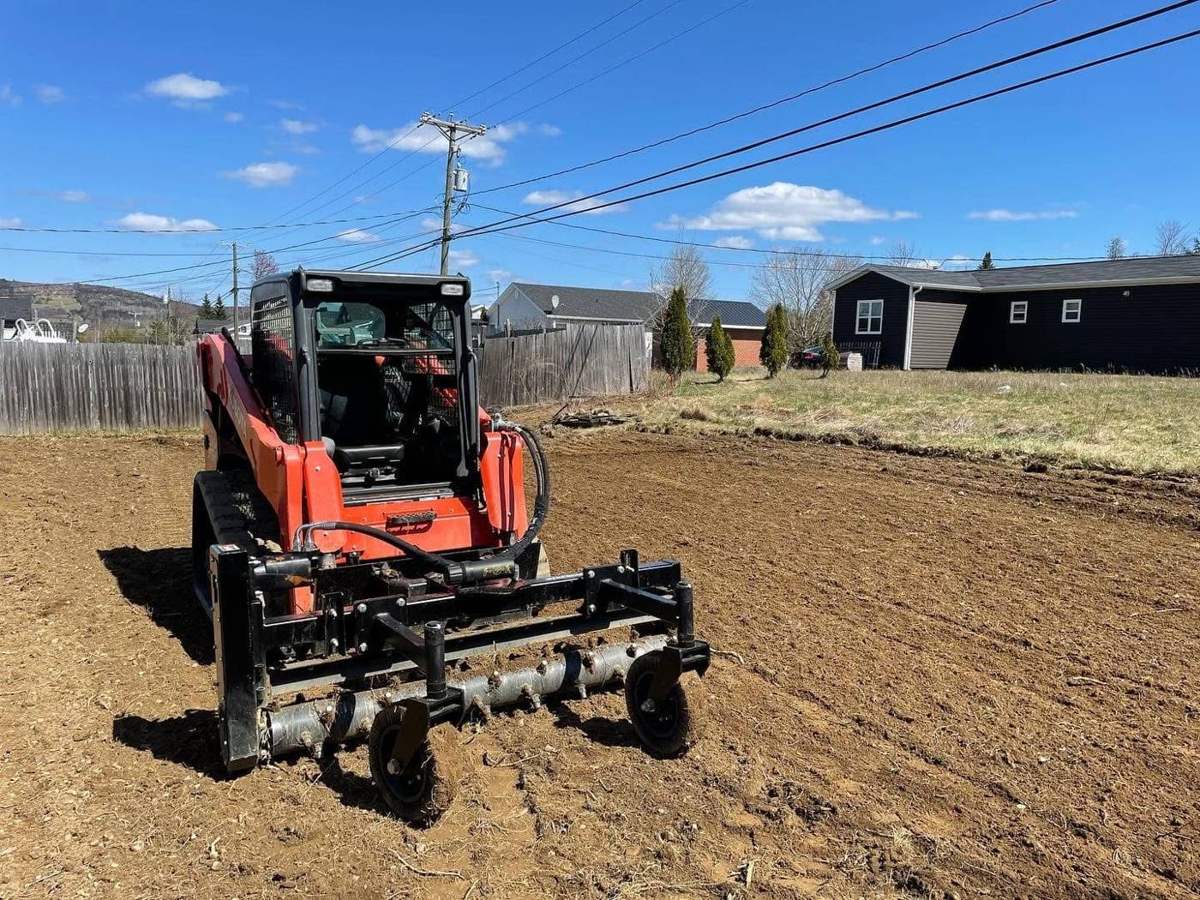 Power-raking a lot for new lawn